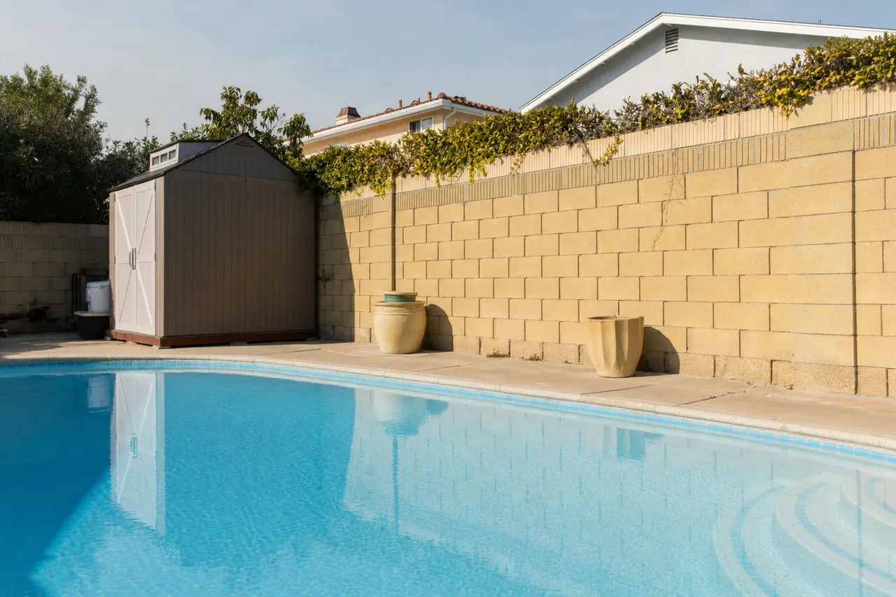 The same Long Beach backyard pool with clean blue water